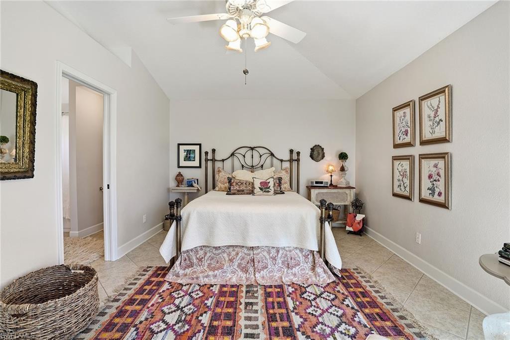 3688 Kent Drive Naples, FL 34112 - Photo 7 of 21 a bedroom with a bed and a window