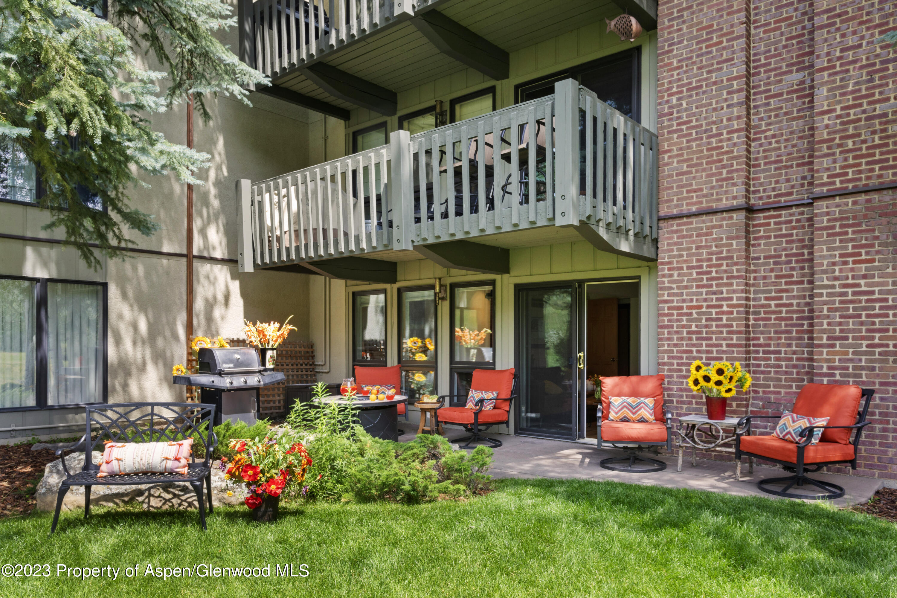 Snowmass Village Snowmass Village, CO 81615 - Photo 18 of 23 a view of a chairs and table in backyard of the house