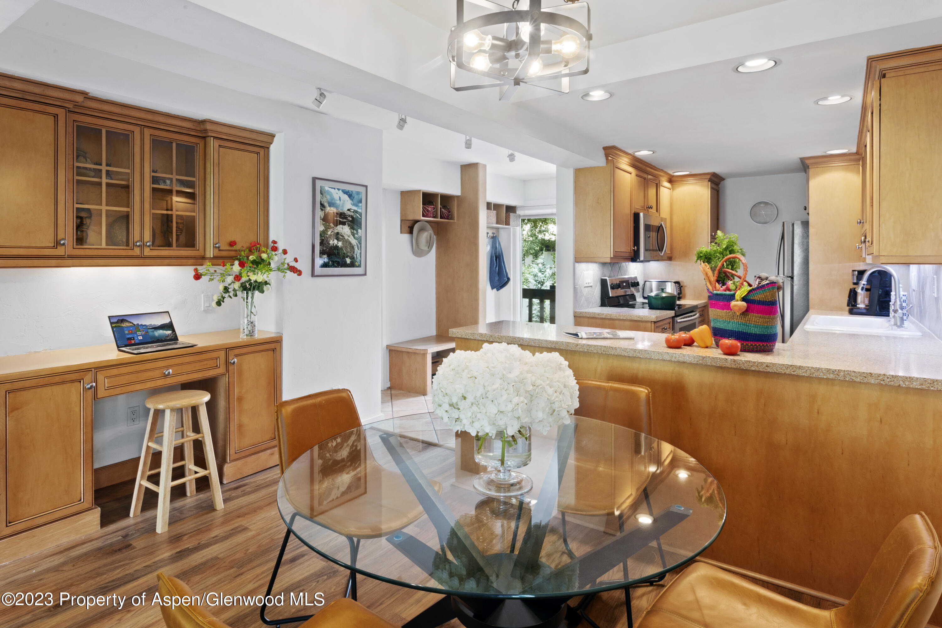 Snowmass Village Snowmass Village, CO 81615 - Photo 4 of 23 a view of a dining room with furniture a chandelier and wooden floor
