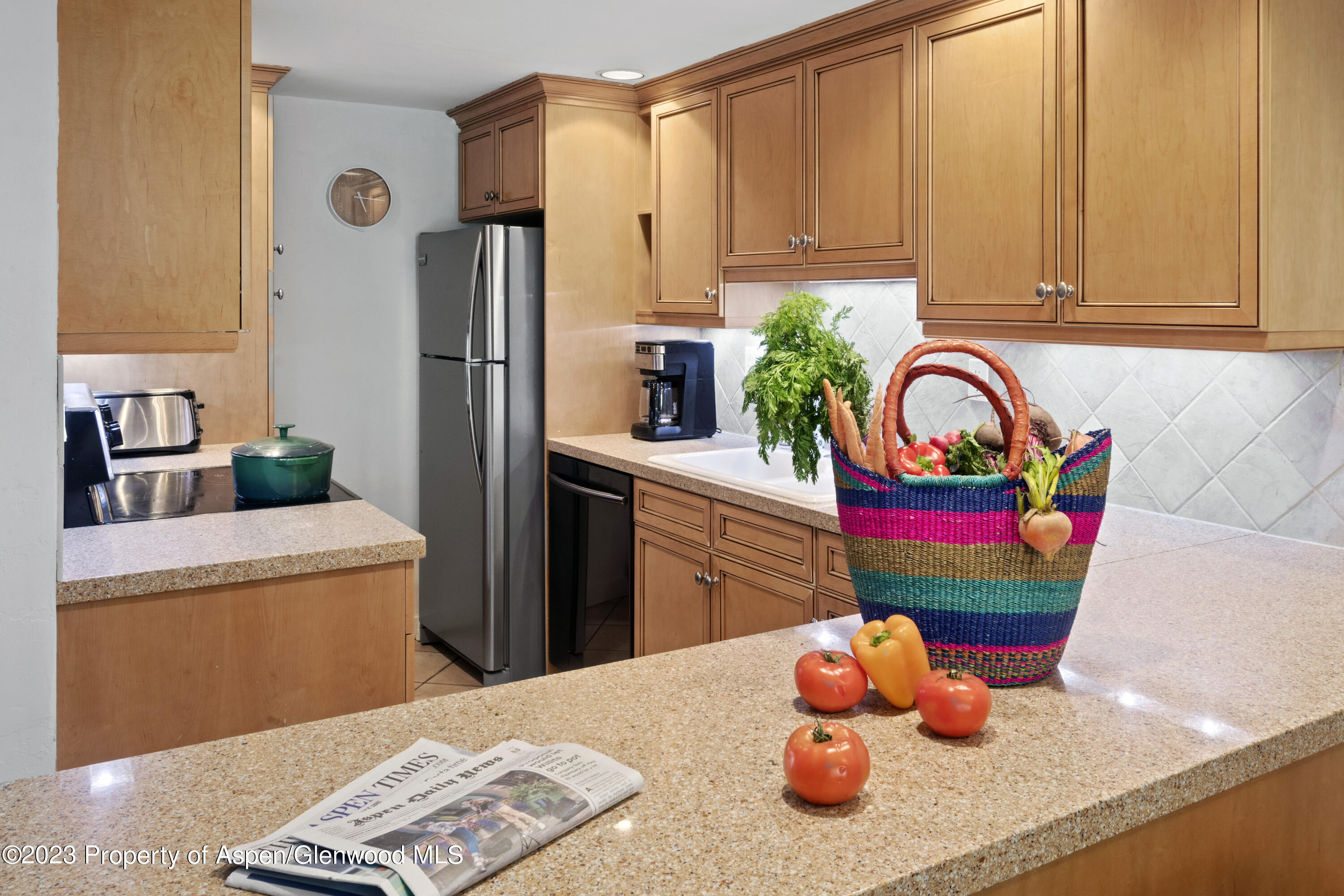 Snowmass Village Snowmass Village, CO 81615 - Photo 5 of 23 a kitchen with stainless steel appliances a refrigerator sink and cabinets