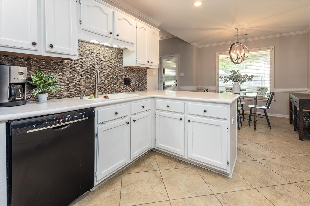905 Grapevine Drive Collierville, TN 38017 - Photo 11 of 25 a kitchen with a cabinets and window