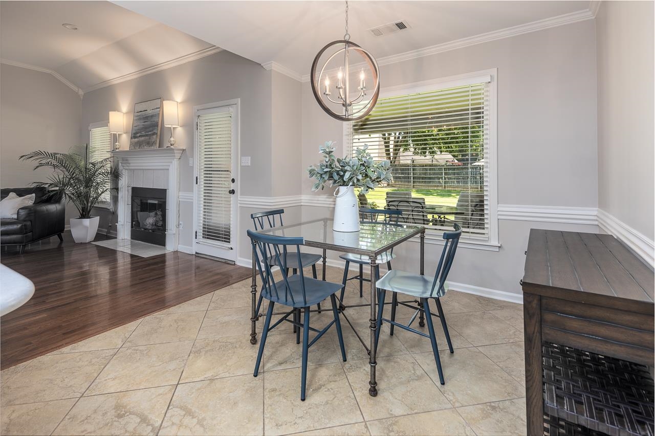 905 Grapevine Drive Collierville, TN 38017 - Photo 14 of 25 a view of a dining room with furniture window and wooden floor