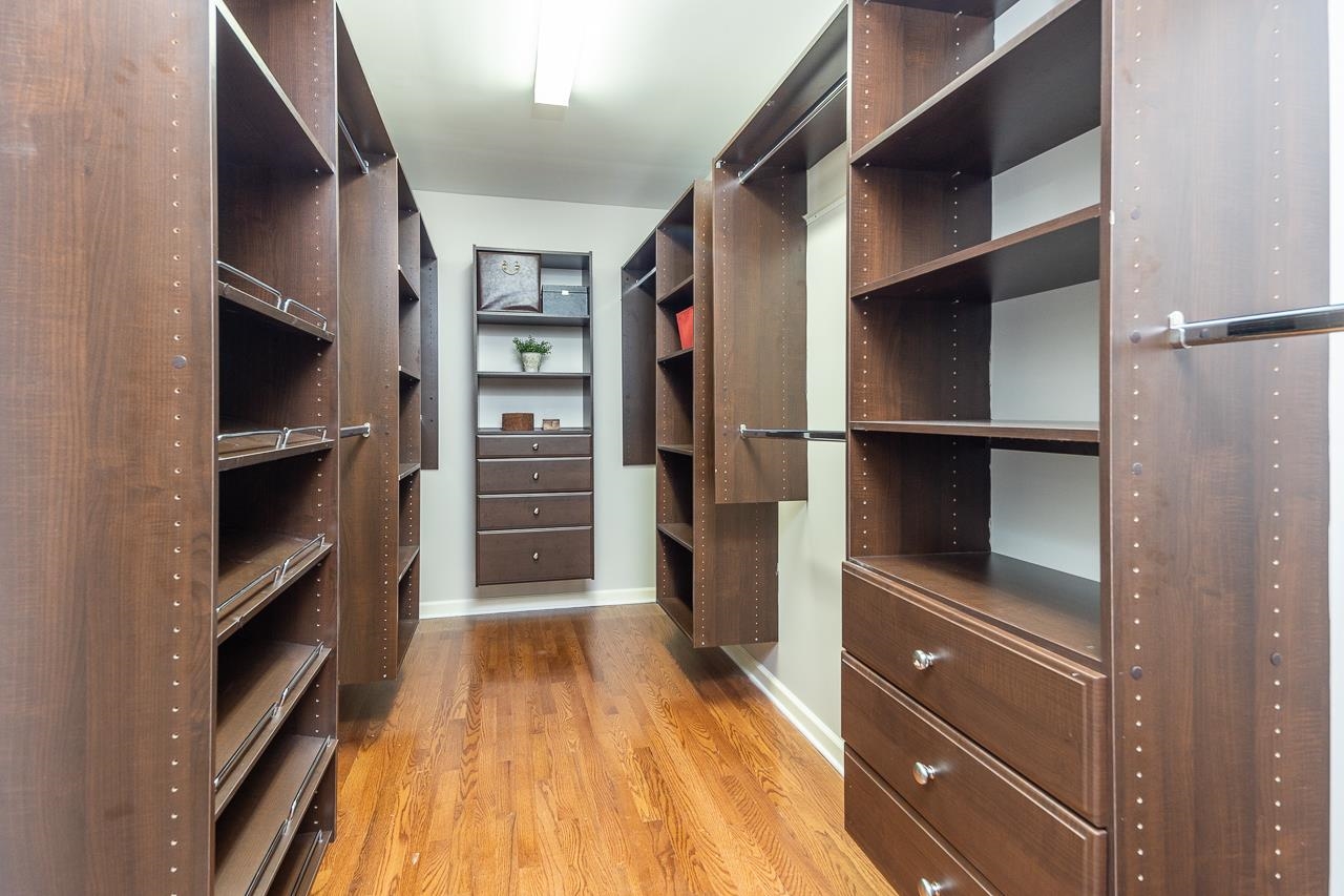 905 Grapevine Drive Collierville, TN 38017 - Photo 19 of 25 a view of walk in closet with clothes and shoes