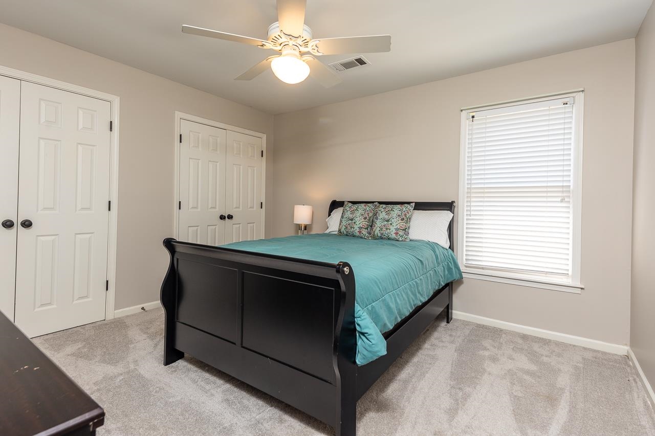 905 Grapevine Drive Collierville, TN 38017 - Photo 20 of 25 a bedroom with a bed and a window