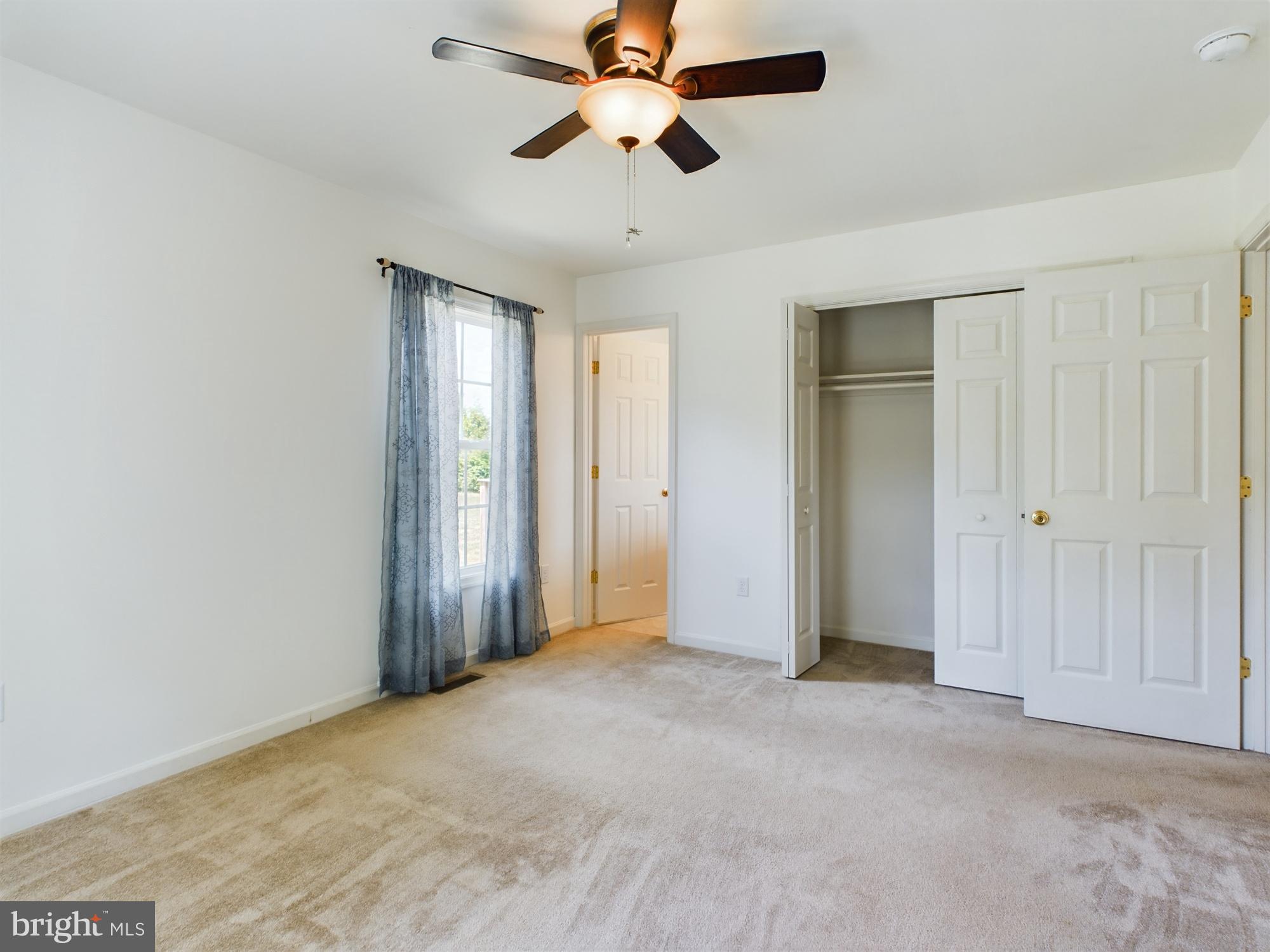 6567 Sharptown Road Laurel, DE 19956 - Photo 19 of 22 primary bedroom suite with views of backyard