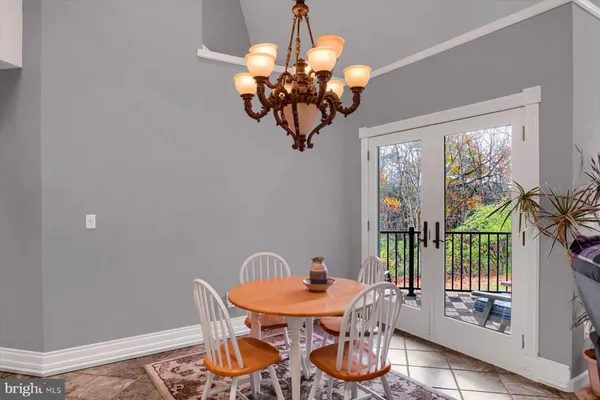 a living room with furniture a fireplace and kitchen view