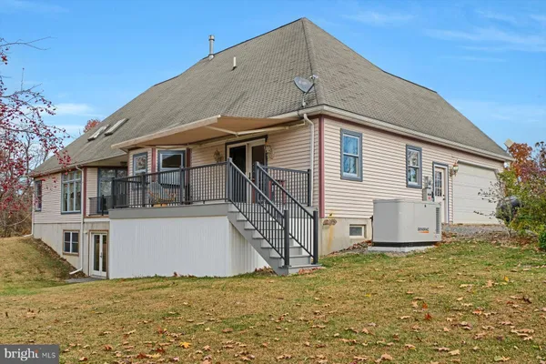 a house that has a tree in front of it
