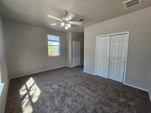 a view of an empty room and window