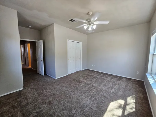 a spacious bathroom with a sink a toilet and a bathtub