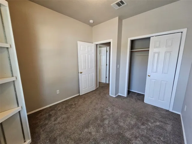 a view of an empty room with a fireplace