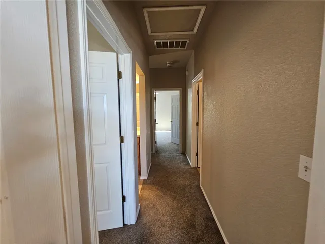 a view of a livingroom with wooden floor and window
