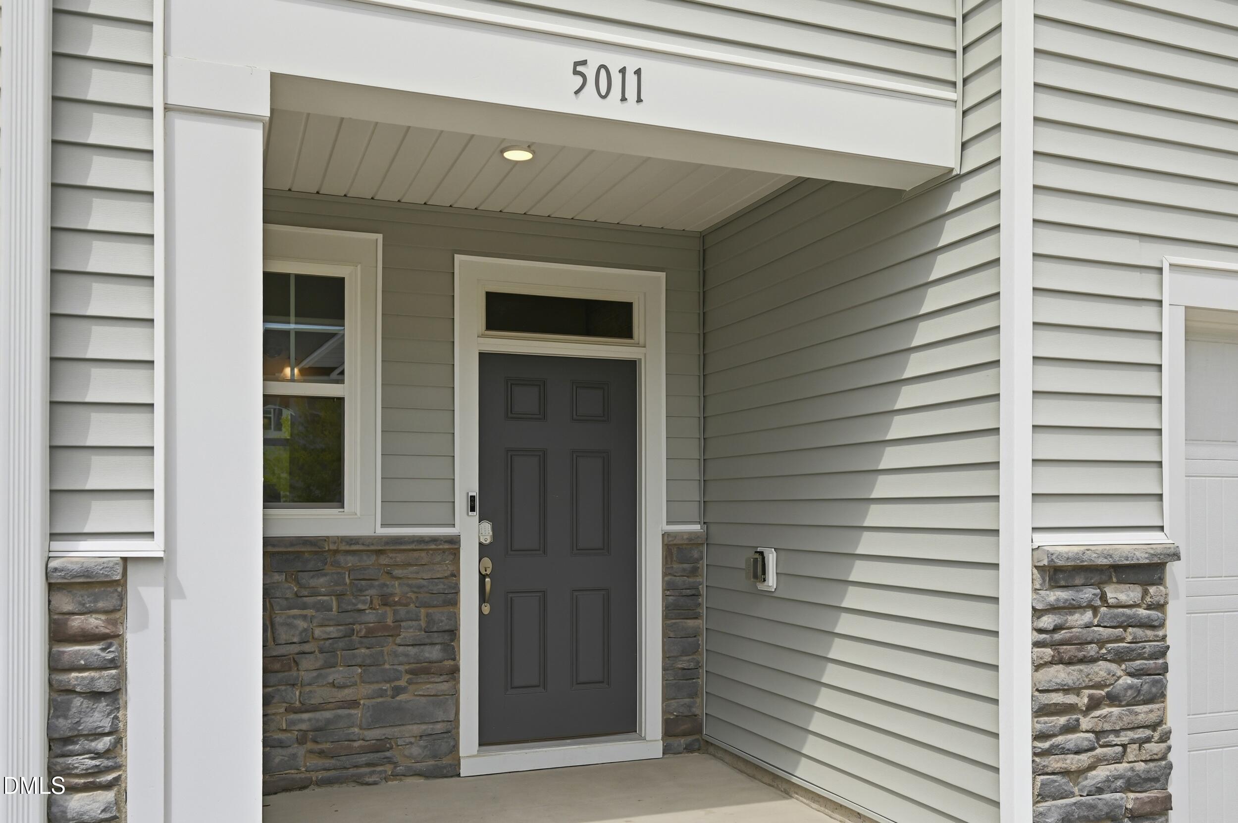 5011 Kota Street Raleigh, NC 27610 - Photo 14 of 42 a front view of a house with a window