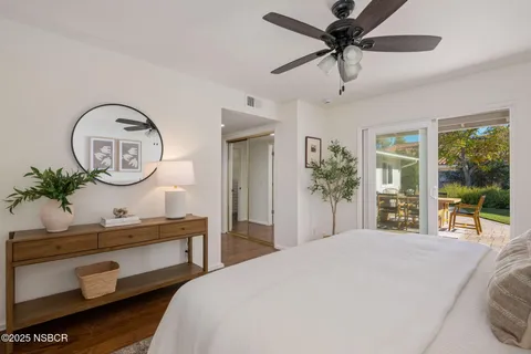a bathroom with a toilet a sink and a large mirror