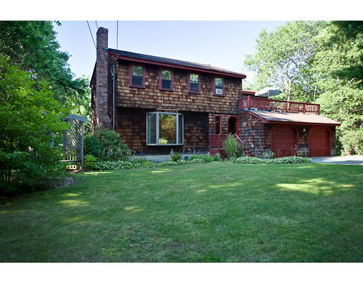 118 Crooked Spring Road Chelmsford, MA 01863 - Photo 1 of 13 a front view of a house with garden