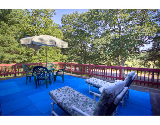 118 Crooked Spring Road Chelmsford, MA 01863 - Photo 13 of 13 a view of a roof deck with chairs and wooden floor