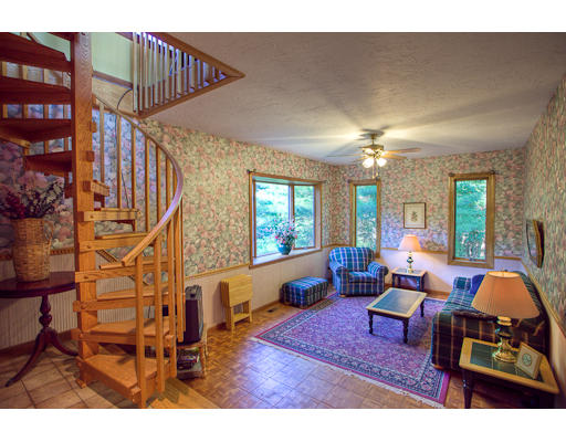 118 Crooked Spring Road Chelmsford, MA 01863 - Photo 5 of 13 a living room with furniture a dining table and a chandelier