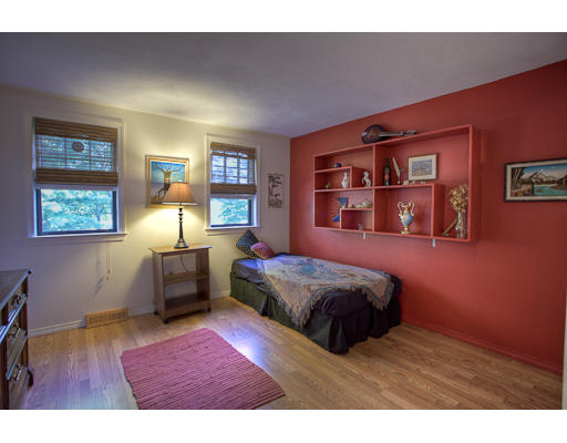 118 Crooked Spring Road Chelmsford, MA 01863 - Photo 10 of 13 a bedroom with a bed and a bookshelf with wooden floor