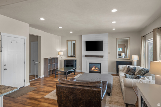 955 Delorean Lane Midvale, UT 84047 - Photo 6 of 47 Living area featuring wood-finish flooring and recessed lighting