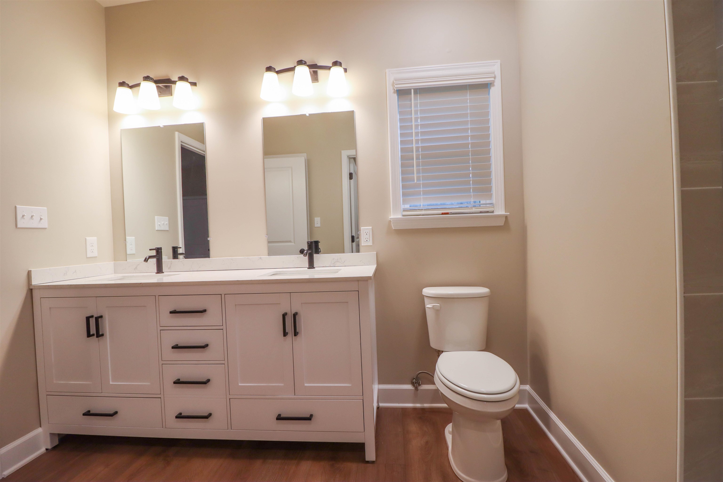 208 Church Street Ripley, TN 38063 - Photo 15 of 33 Primary EnSuite with double vanities ,tile shower walk in closet and laundry room