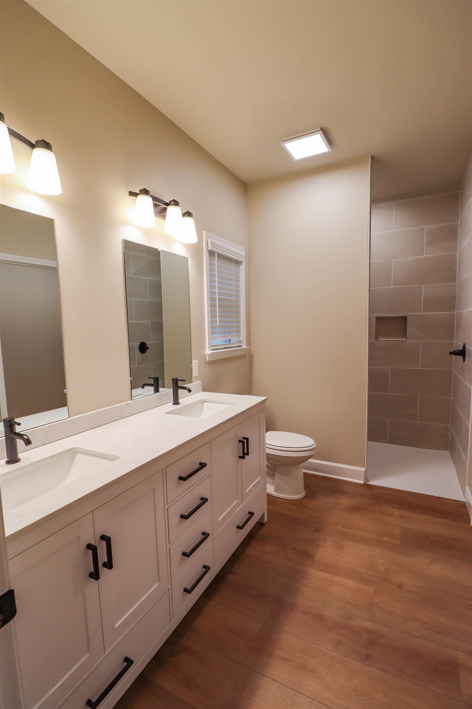 208 Church Street Ripley, TN 38063 - Photo 16 of 33 Primary EnSuite with double vanities ,tile shower walk in closet and laundry room