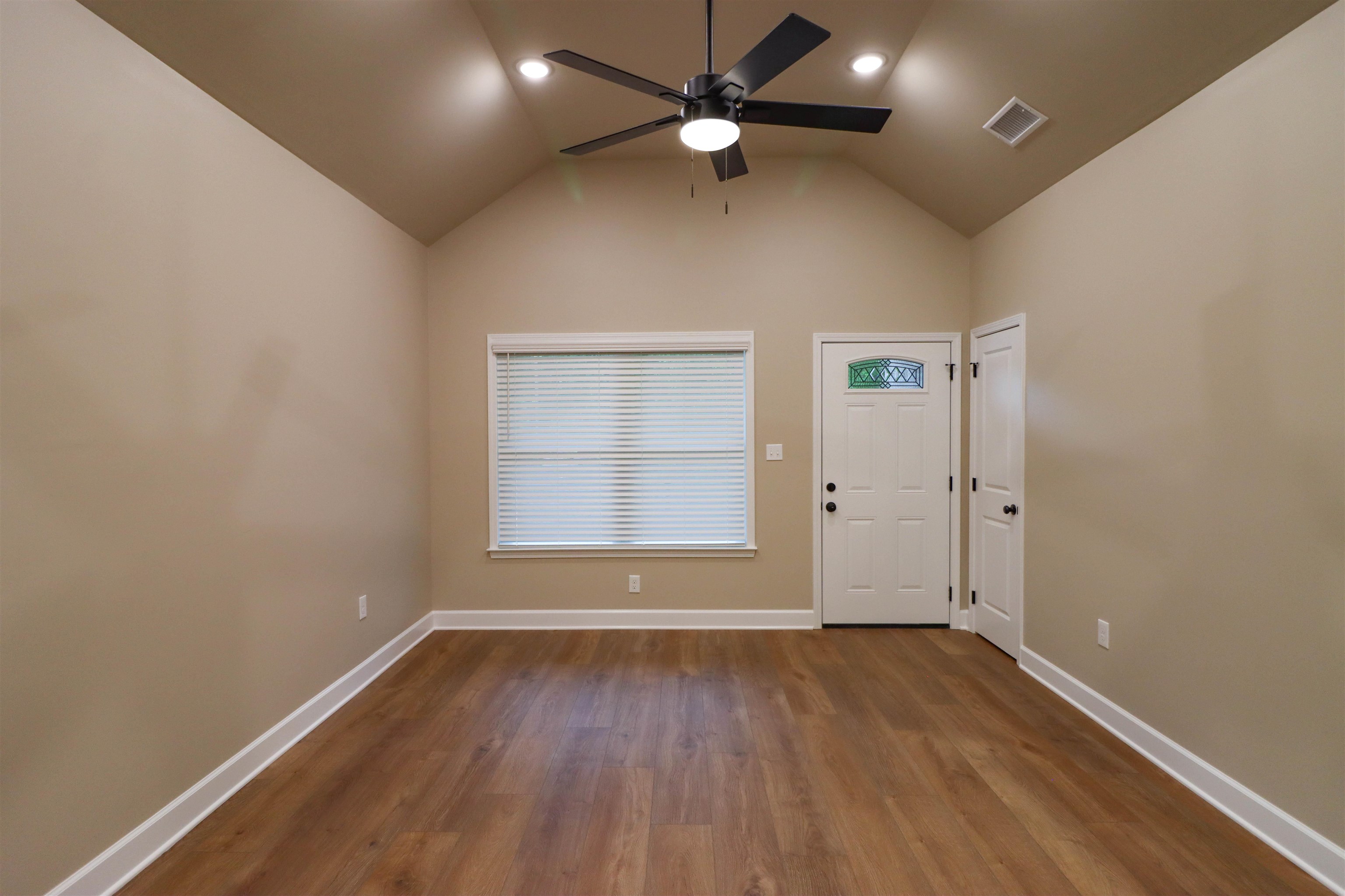 208 Church Street Ripley, TN 38063 - Photo 6 of 33 Great Room featuring a ceiling fan, dark wood-style flooring, high vaulted ceiling.