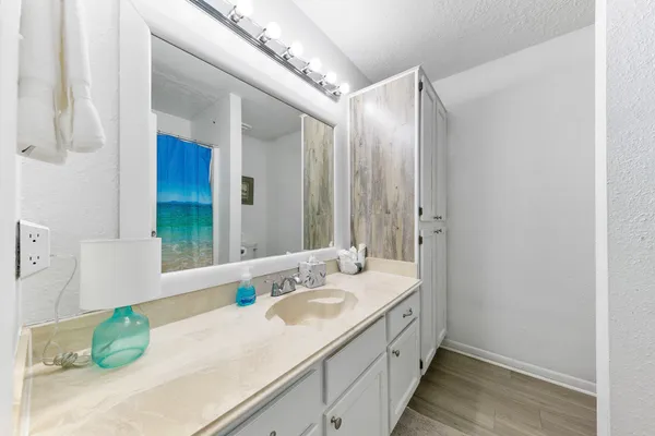 a bathroom with a double vanity sink and a mirror