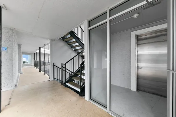 a view of a hallway with staircase