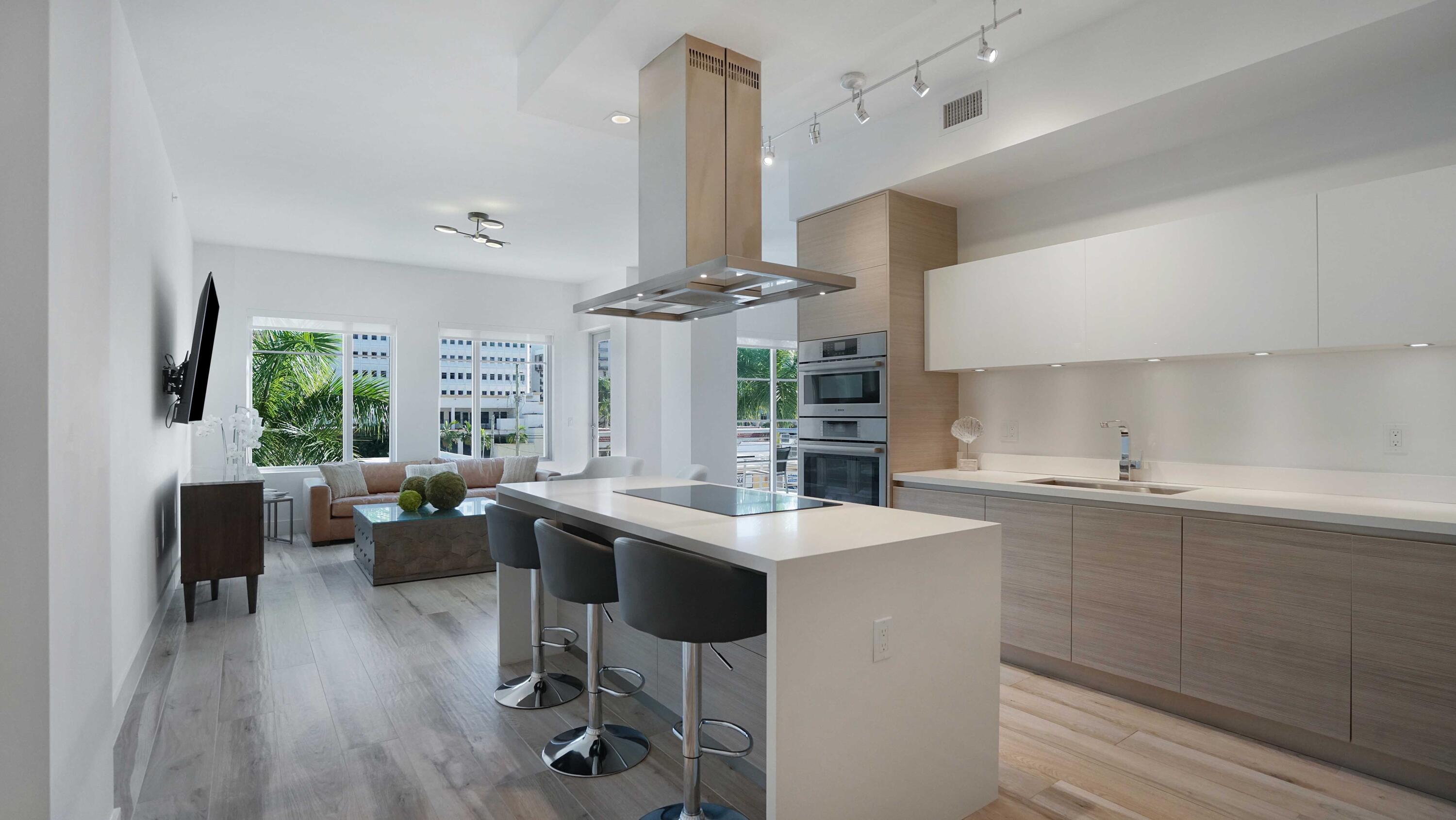 155 East Boca Raton Road, Unit 301 Boca Raton, FL 33432 - Photo 6 of 60 a kitchen with stainless steel appliances a sink a stove and a refrigerator