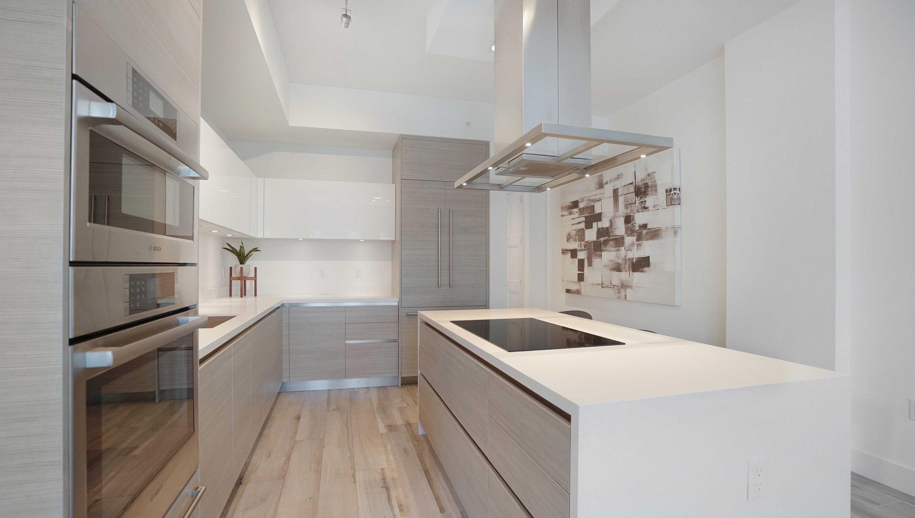 155 East Boca Raton Road, Unit 301 Boca Raton, FL 33432 - Photo 8 of 60 a kitchen with granite countertop a sink and stainless steel appliances