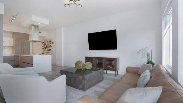 a living room with furniture fireplace and a flat screen tv