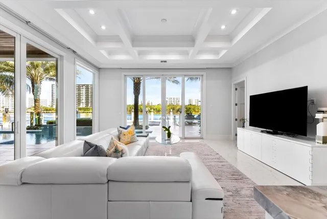 a view of a patio with table and chairs and potted plants