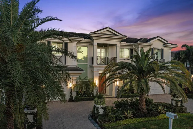 front view of a house with potted plants