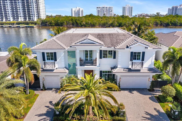 a dining room with furniture a window and a chandelier