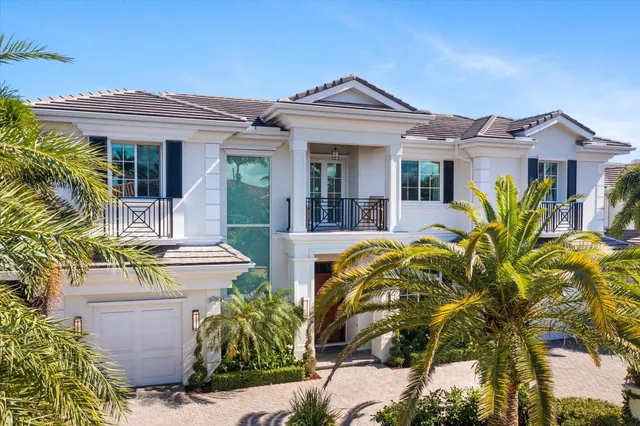 a kitchen with kitchen island granite countertop a sink stainless steel appliances and cabinets