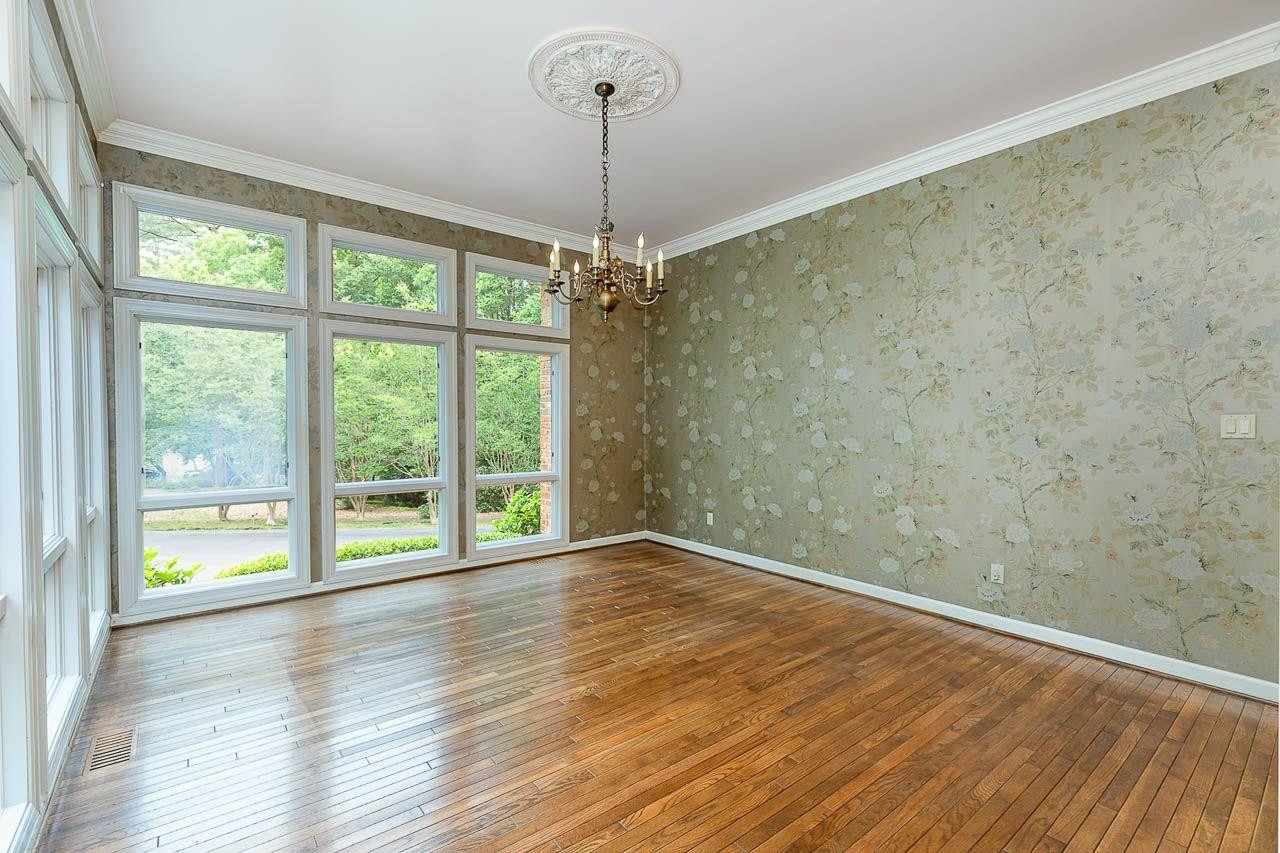 212 Carpathian Way Raleigh, NC 27615 - Photo 18 of 31 Floor to ceiling windows in this elegant formal dining Formal Dining