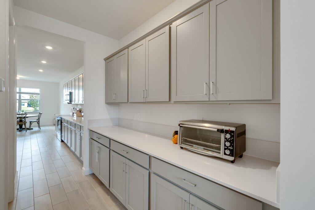 12328 Southwest Roma Circle Port St. Lucie, FL 34987 - Photo 11 of 72 Pantry to Kitchen.jpg-SMALL