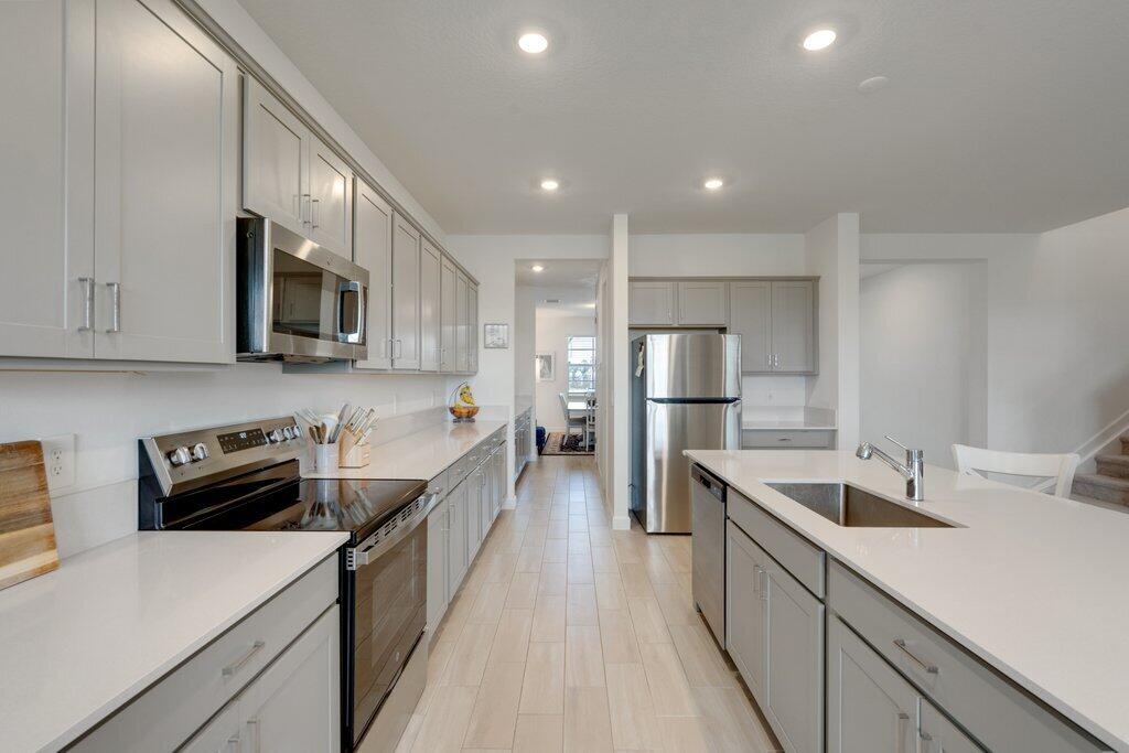 12328 Southwest Roma Circle Port St. Lucie, FL 34987 - Photo 15 of 72 Kitchen to Dining.jpeg-SMALL