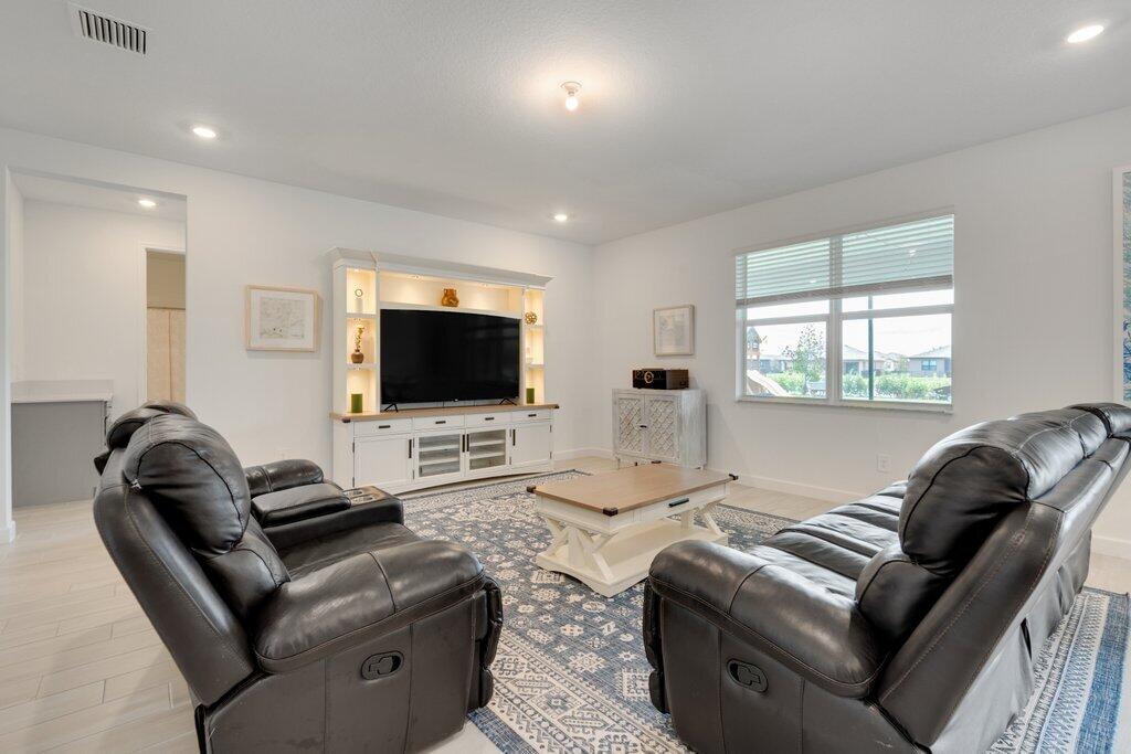 12328 Southwest Roma Circle Port St. Lucie, FL 34987 - Photo 21 of 72 Living Room R.jpeg-SMALL