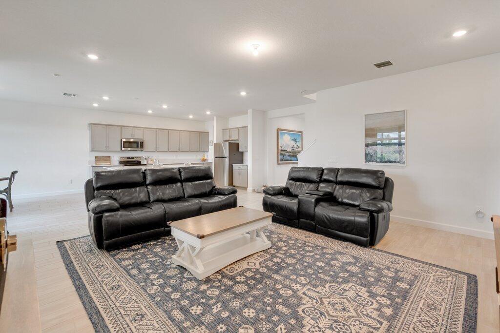 12328 Southwest Roma Circle Port St. Lucie, FL 34987 - Photo 24 of 72 Living Room to Kitchen.jpeg-SMALL