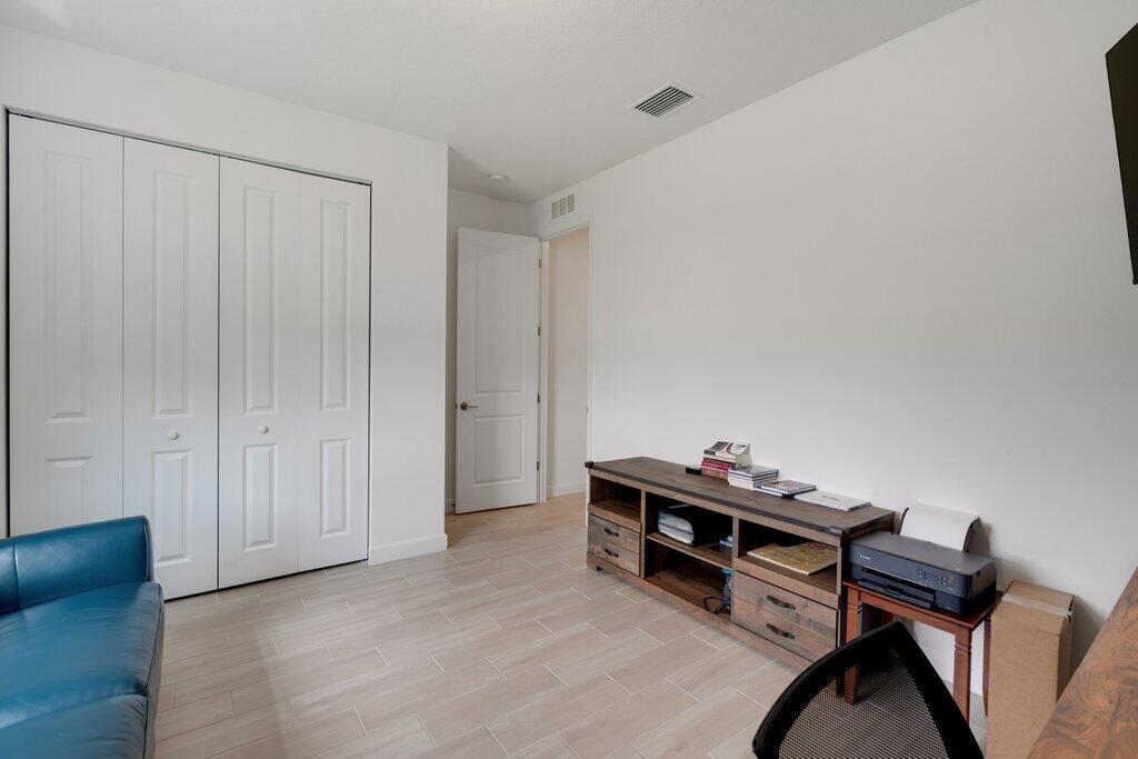 12328 Southwest Roma Circle Port St. Lucie, FL 34987 - Photo 26 of 72 Bedroom to Entry.jpeg-SMALL