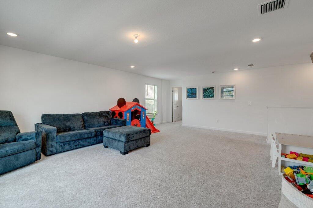 12328 Southwest Roma Circle Port St. Lucie, FL 34987 - Photo 32 of 72 2nd Story Family to Primary Bedroom.jpg-