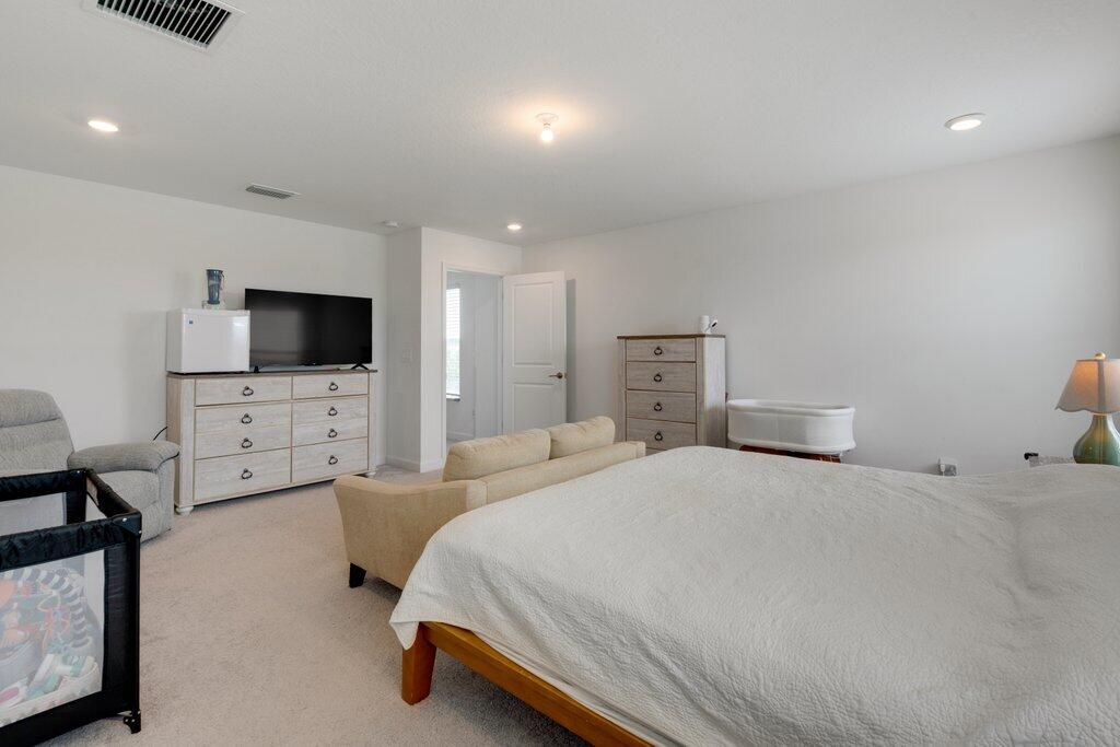 12328 Southwest Roma Circle Port St. Lucie, FL 34987 - Photo 35 of 72 Primary Bedroom to Entry.jpeg-SMALL