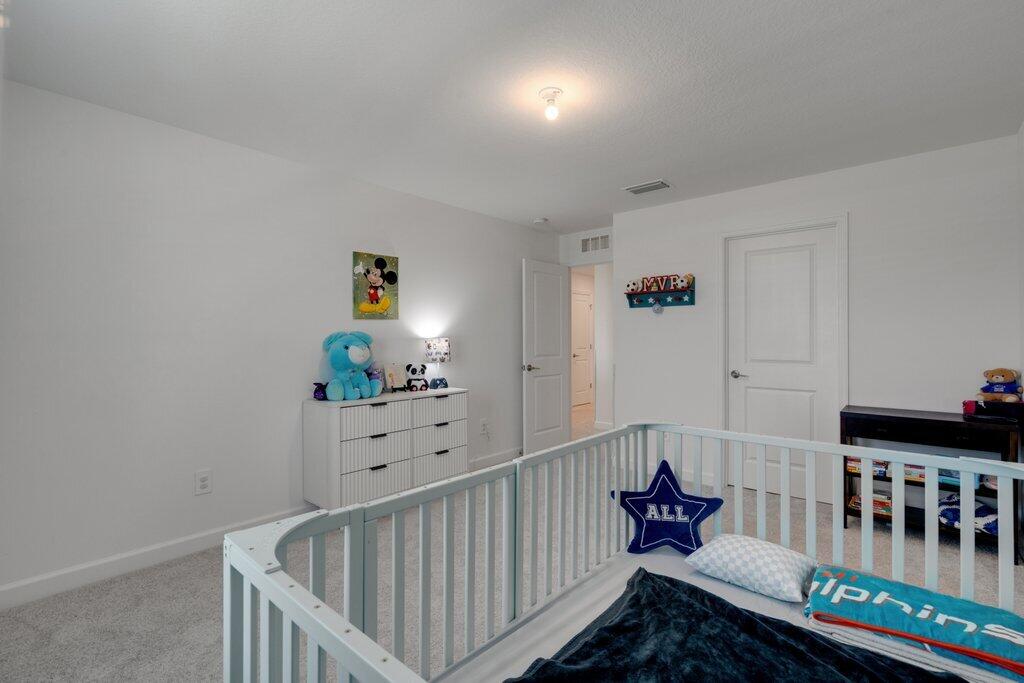 12328 Southwest Roma Circle Port St. Lucie, FL 34987 - Photo 50 of 72 Bedroom 3rd to Entry.jpeg-SMALL