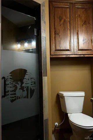 a kitchen with kitchen island granite countertop a stove and a refrigerator