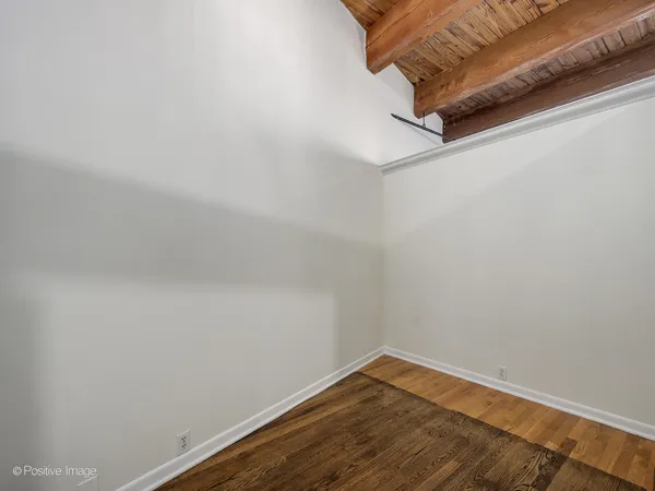a view of a small space with wooden floor