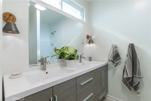 a bathroom with a sink and mirror