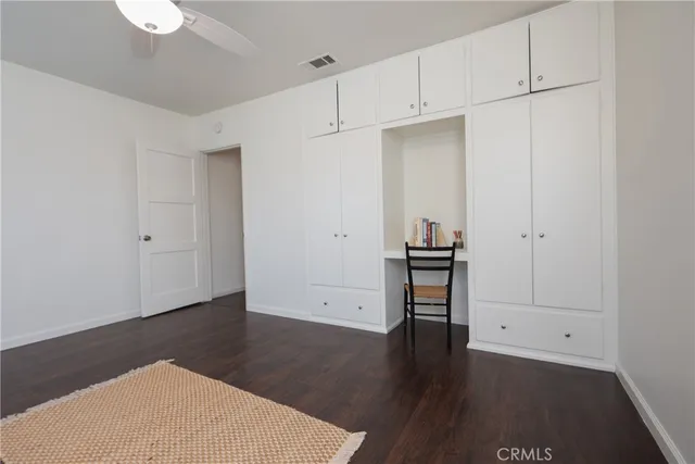 an empty room with wooden floor