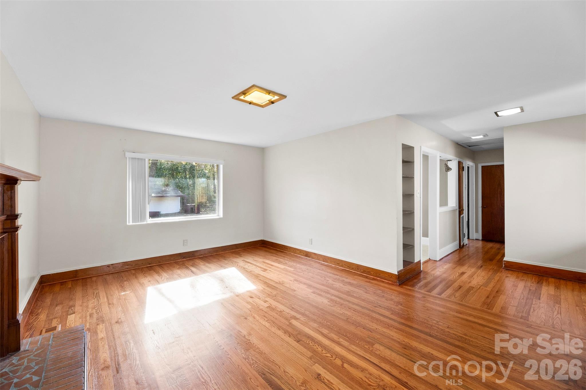 845 St Marks Church Road Cherryville, NC 28021 - Photo 11 of 47 a view of an empty room with wooden floor and a window