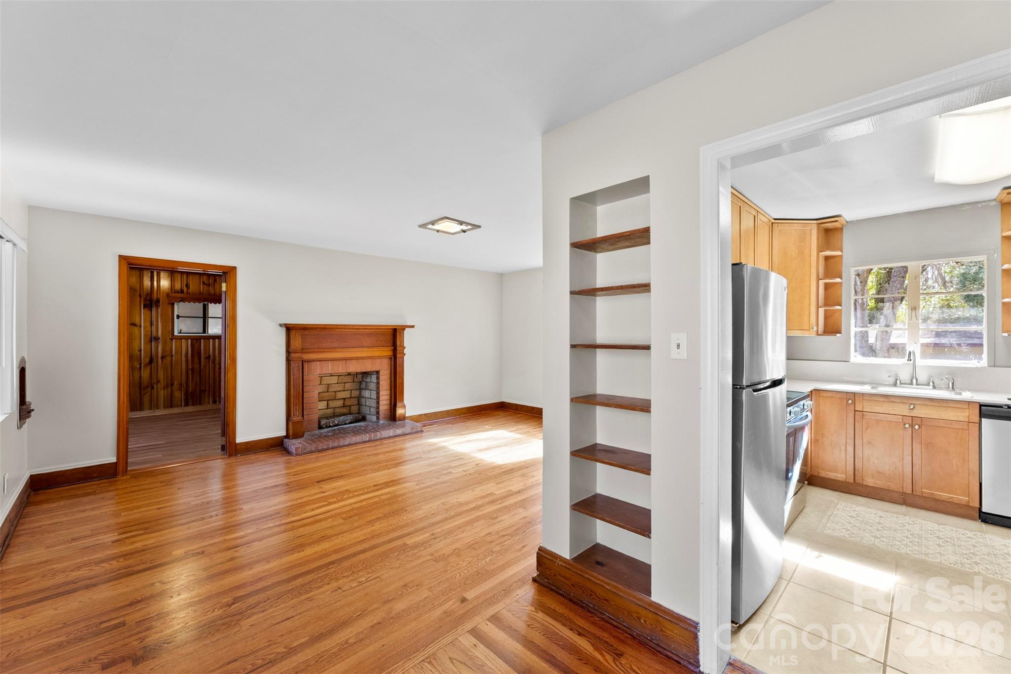 845 St Marks Church Road Cherryville, NC 28021 - Photo 14 of 47 a view of empty room with wooden floor and fireplace