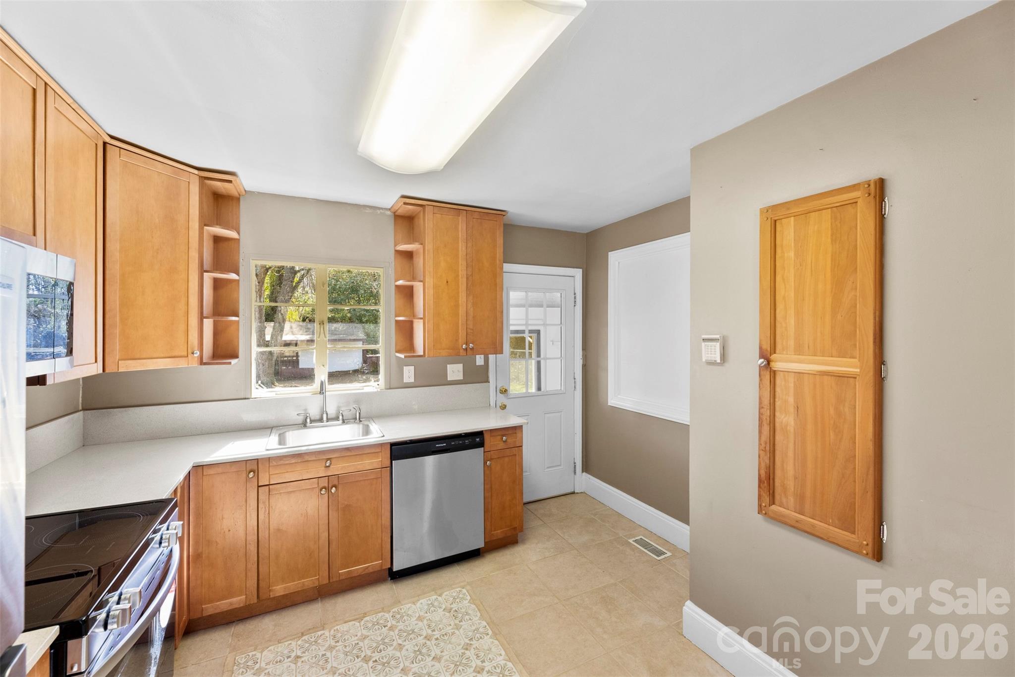 845 St Marks Church Road Cherryville, NC 28021 - Photo 16 of 47 a large kitchen with kitchen island a sink a stove and a refrigerator